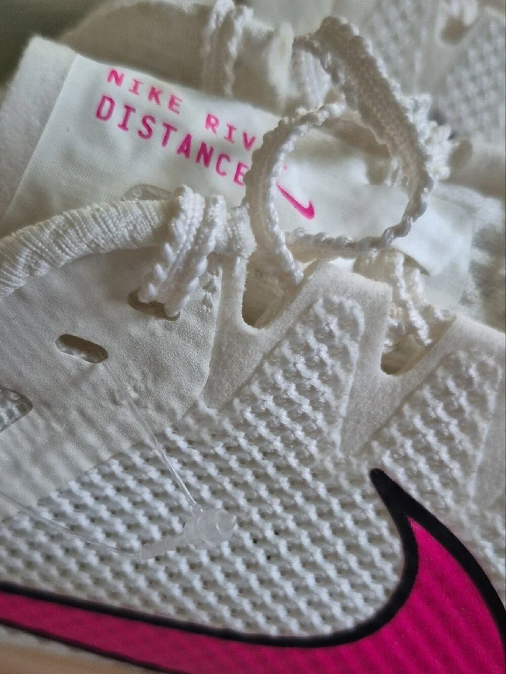Nike White Athletic Shoes with Pink Swoosh